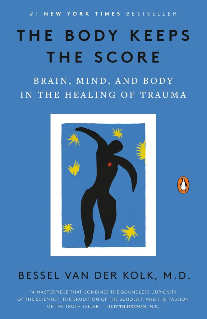 Blue book cover of the book the body keeps the score by bessel van der kolk. Contact trauma informed, EMDR and Somatic Experiencing trained therapists today. Mental health support available online across Ontario.