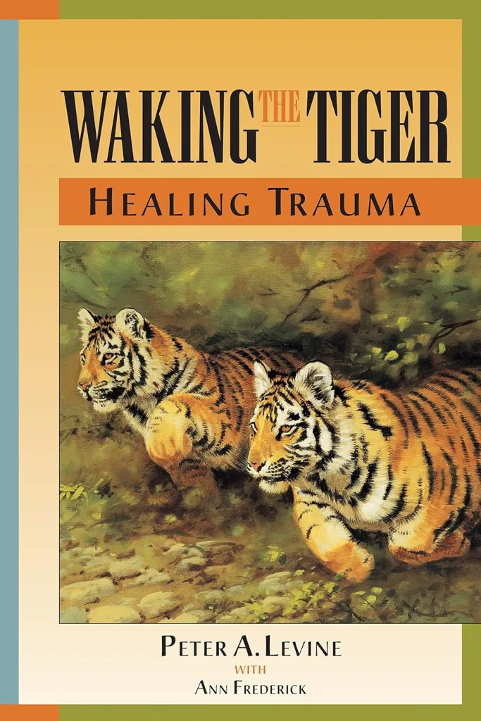 Image of the book Waking the tiger, healing trauma by Peter Levine. On the cover there are two tiger's running. Book your first session Online today with a trauma trained therapist! We offer virtual services across Ontario. We provide EMDR and Somatic Experiencing.